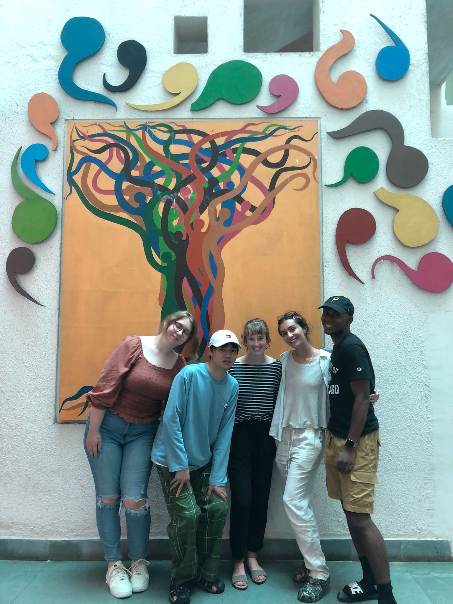 Group of people standing in front of abstract art