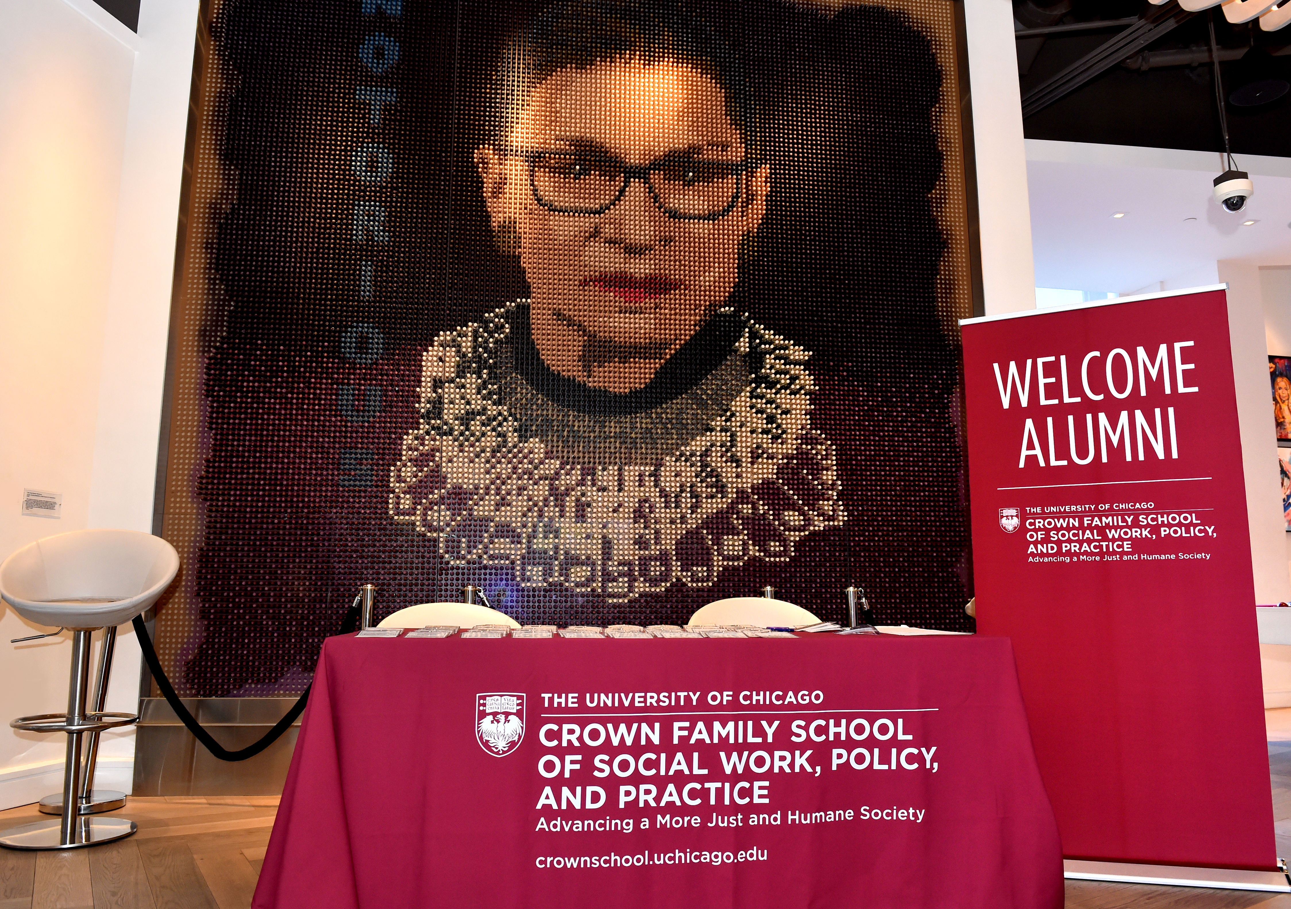 Image of RBG with a table with the Crown Name on it