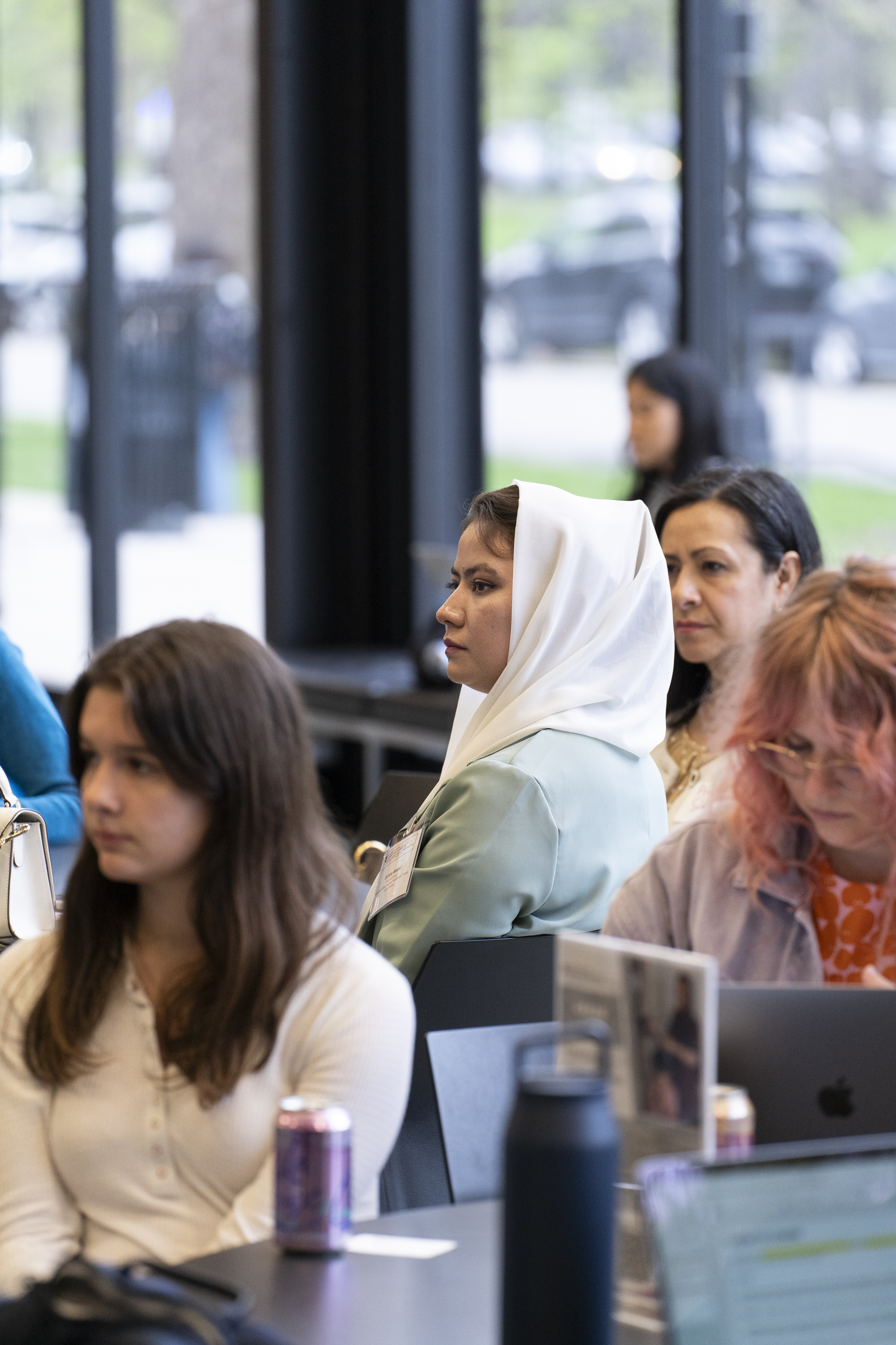 Image of woman in hijab listening