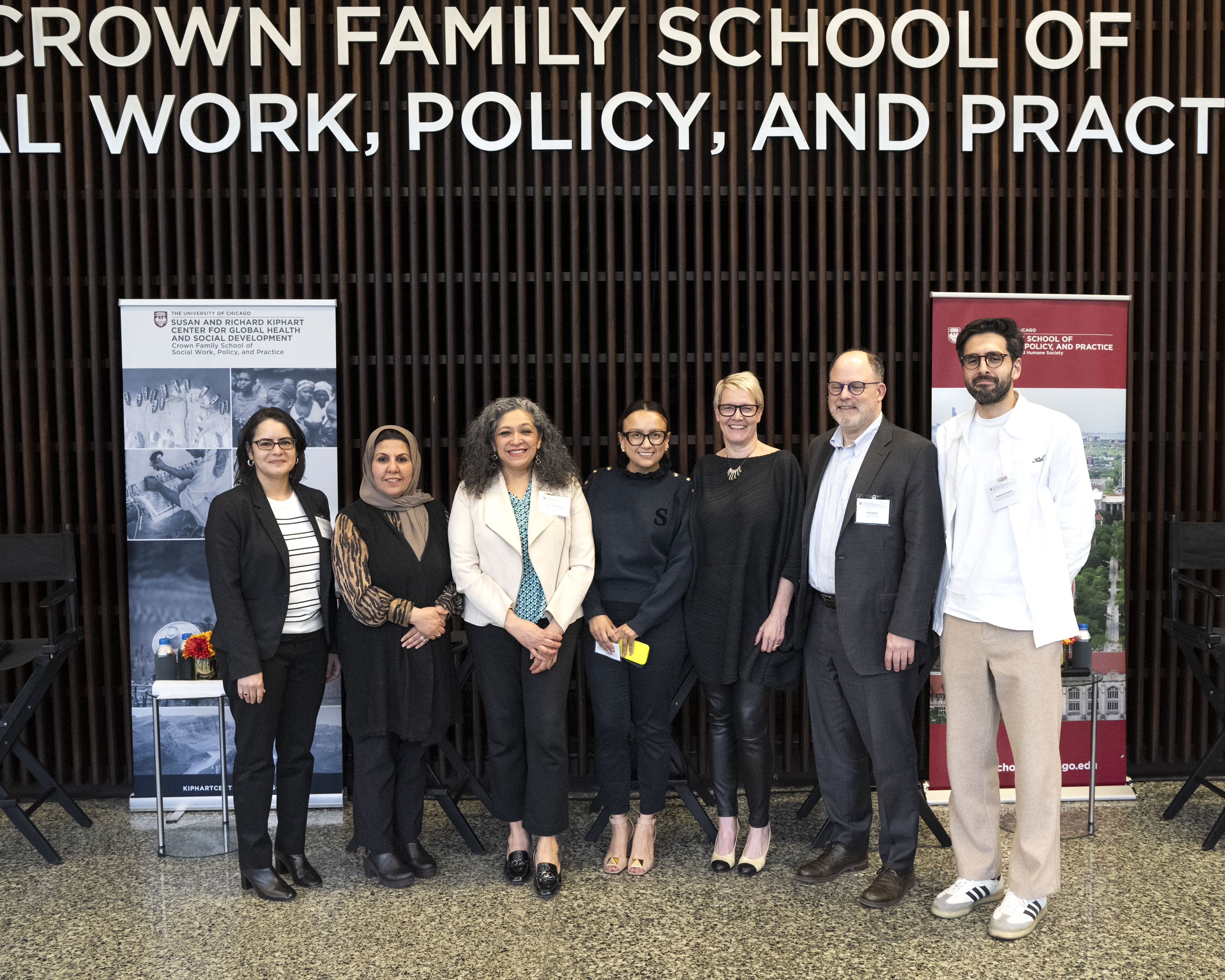 group of panelist standing smiling 