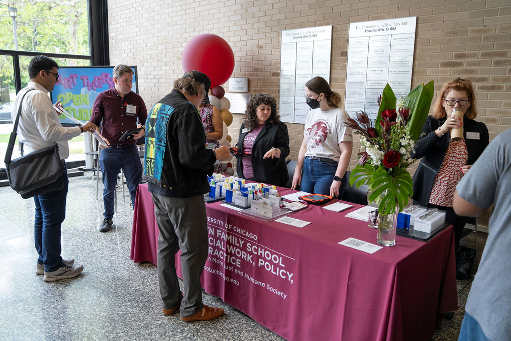 People standing check-in to event 