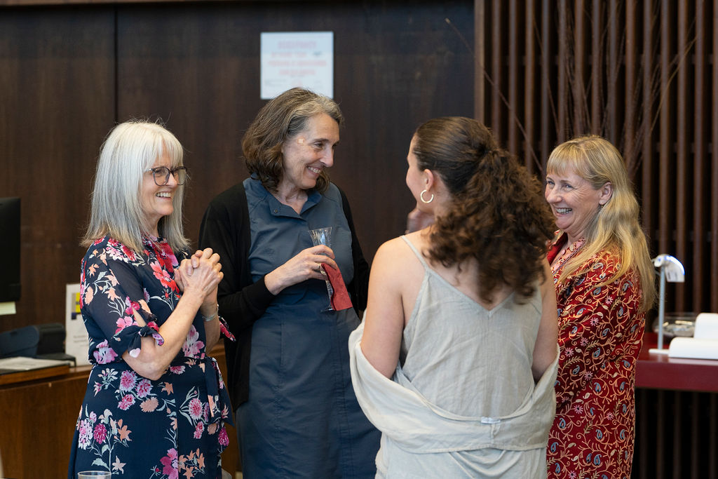 group of women chatting and mingling 