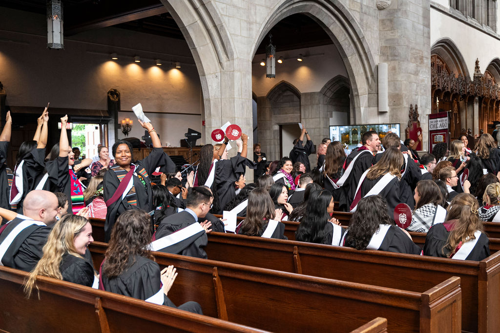 Graduates celebrate from the pews in Rockefeller Chapel. 