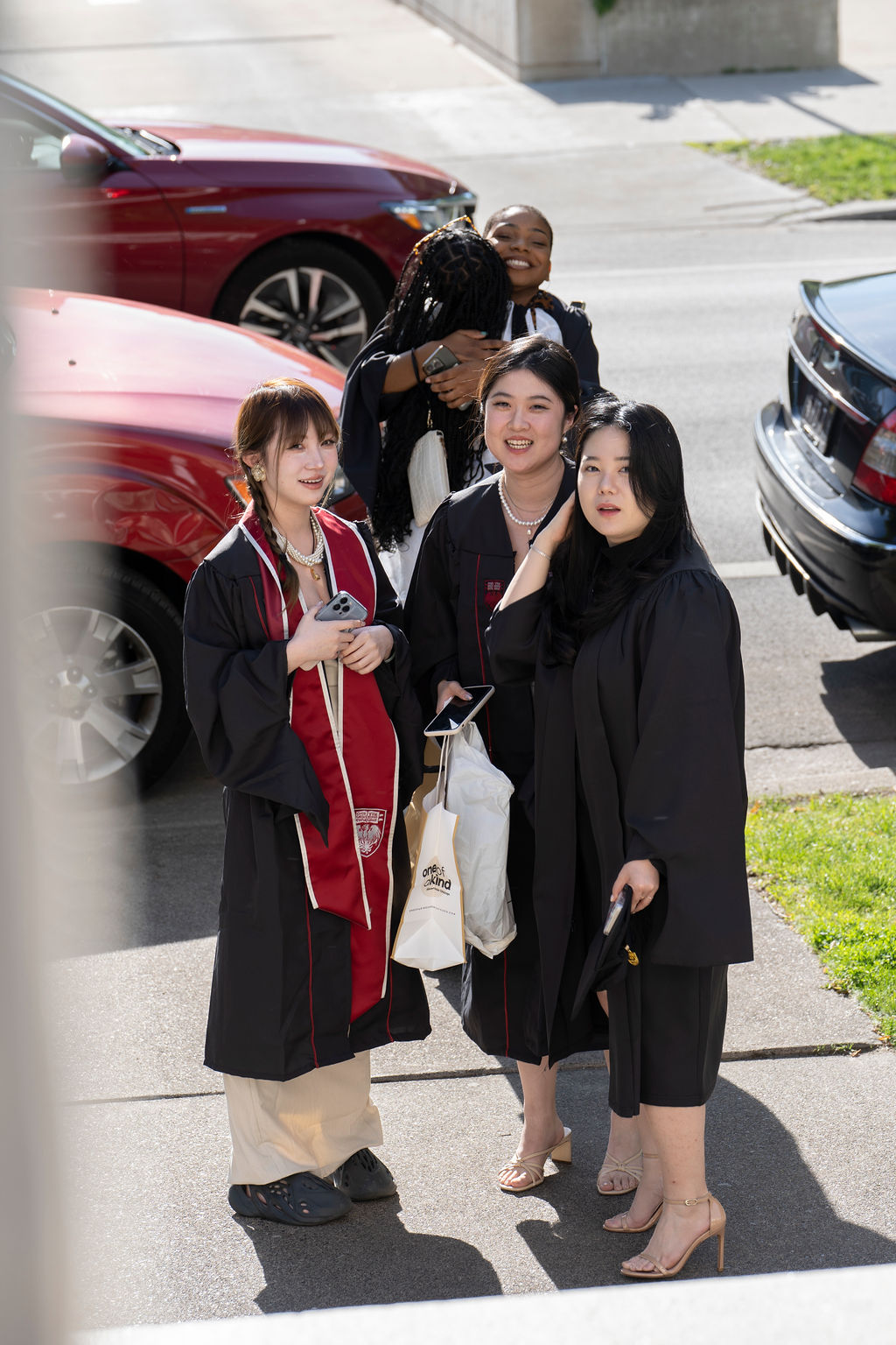 Students stand by friends waiting for ceremony to begin