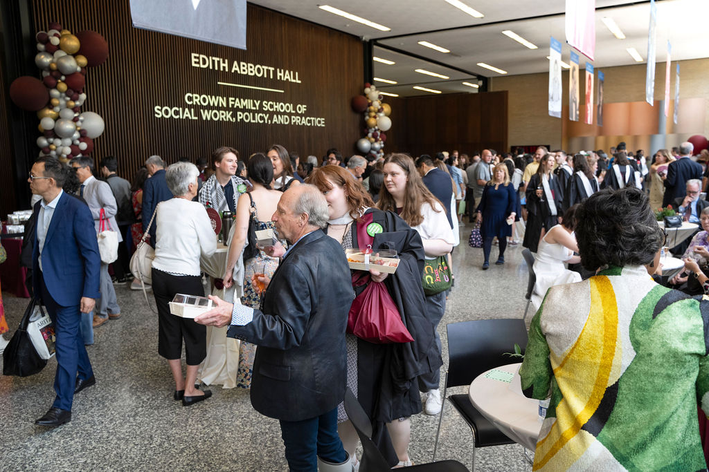 Reception following hooding ceremony gets underway as attendees reunite with family and friends