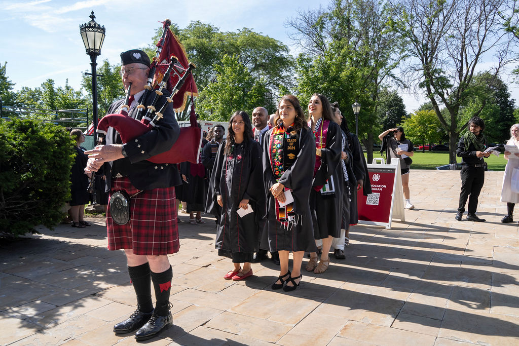 Graduates line up to enter Rockefeller Chapel 