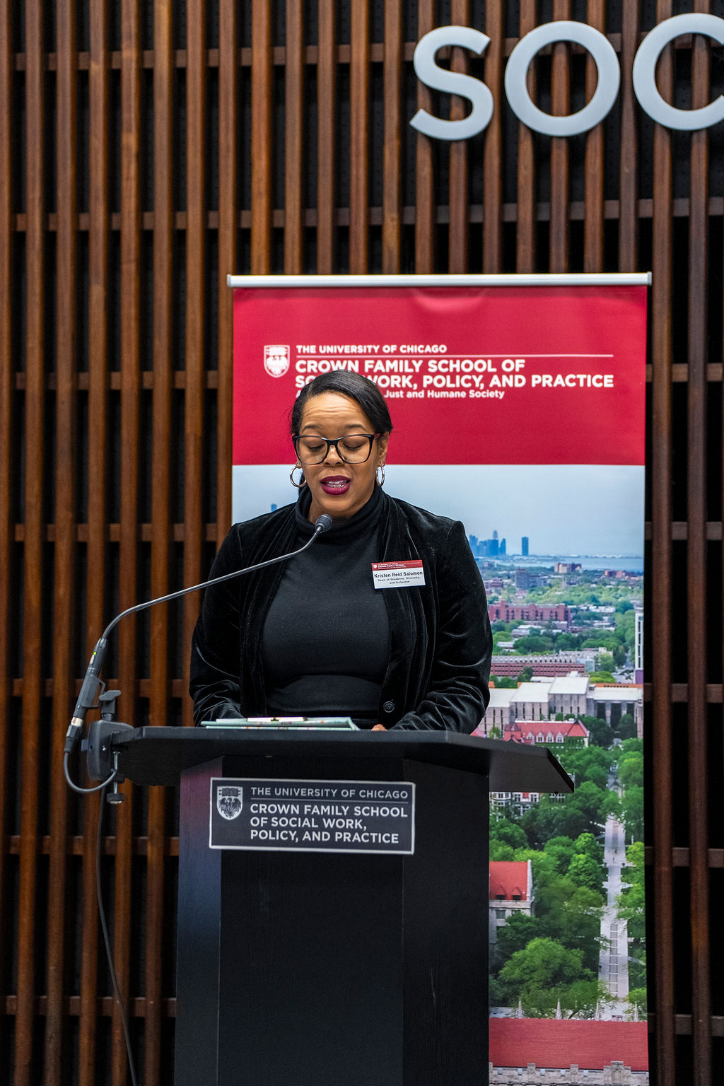 A woman speaking at a podium 
