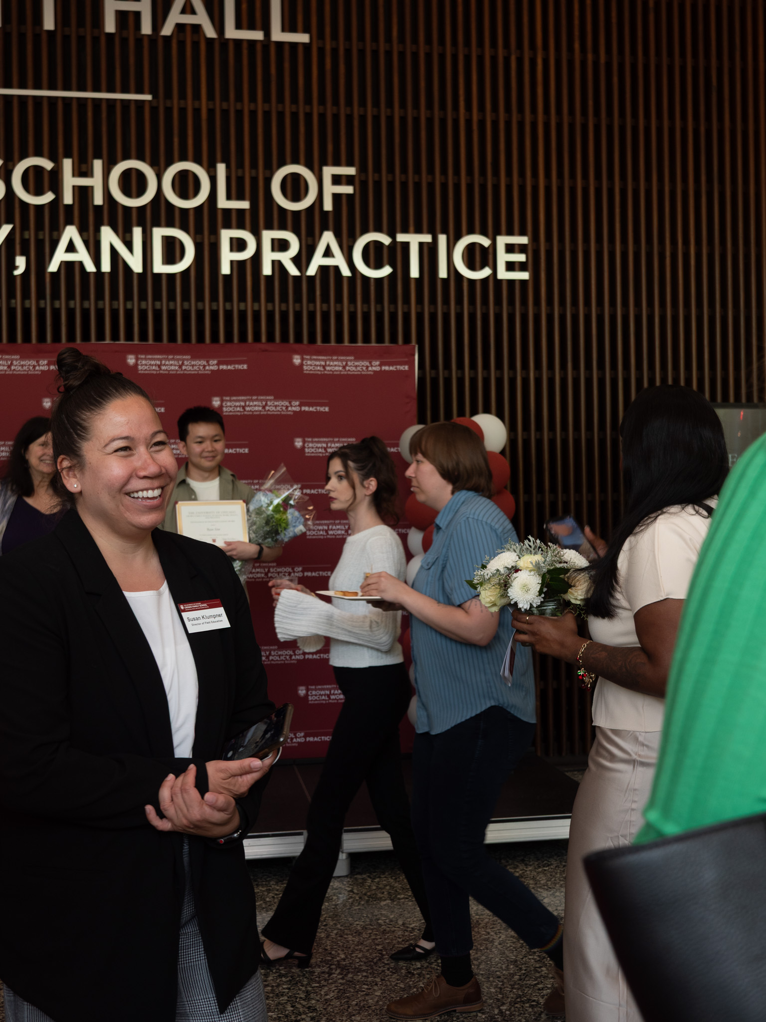 Woman in black blazer smiling