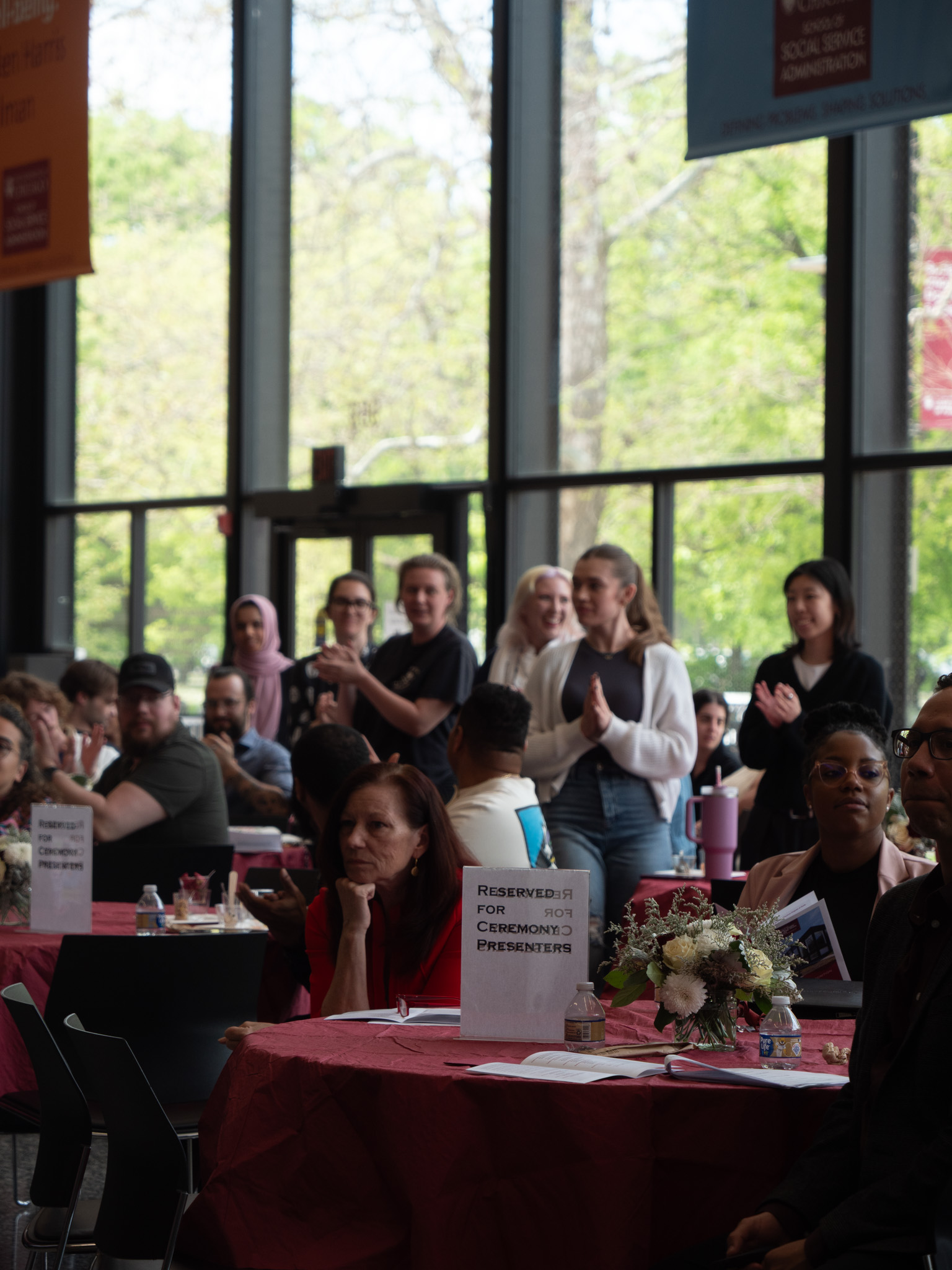 audience members standing and clapping 