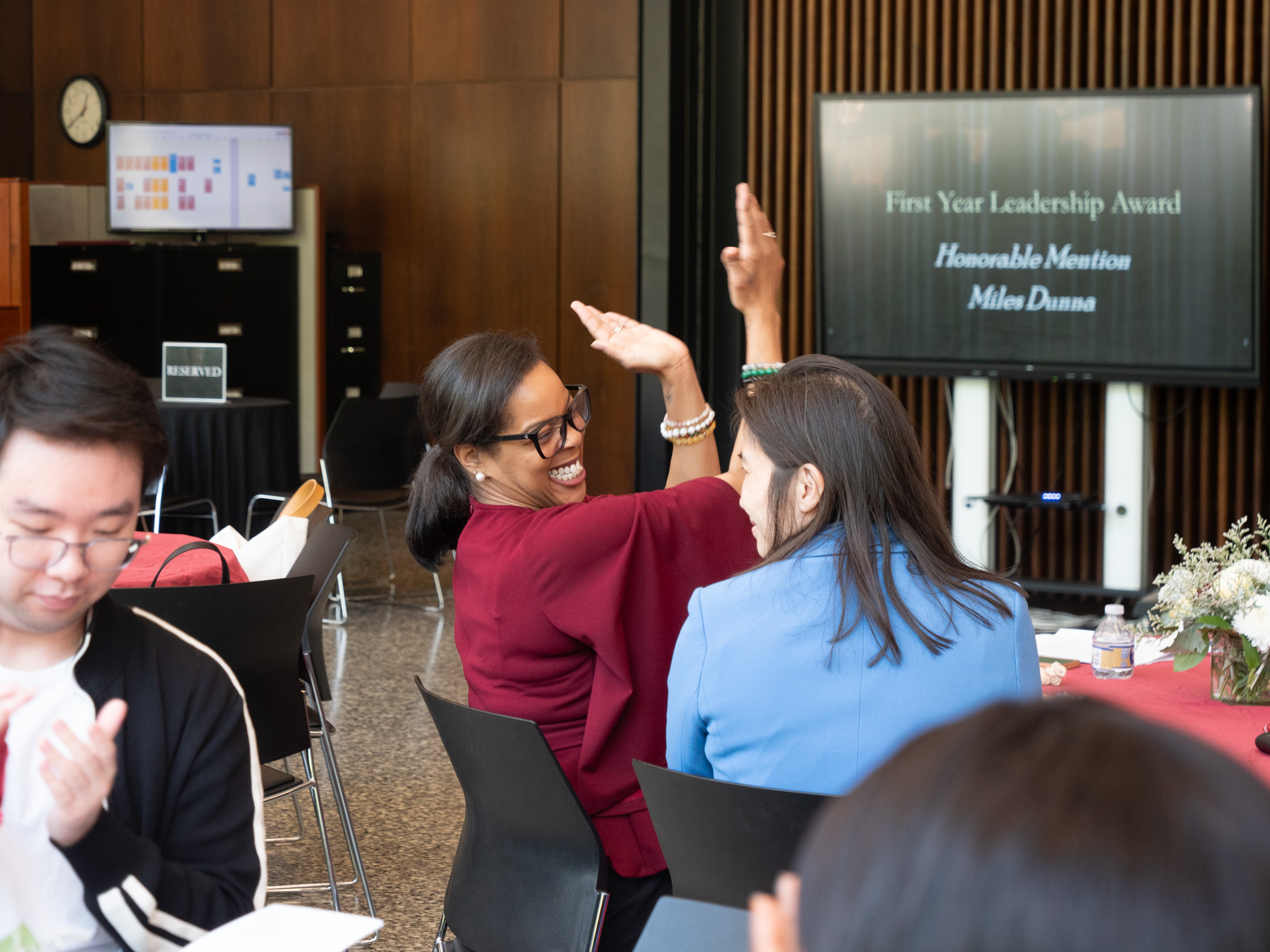audience member smiling and clapping 