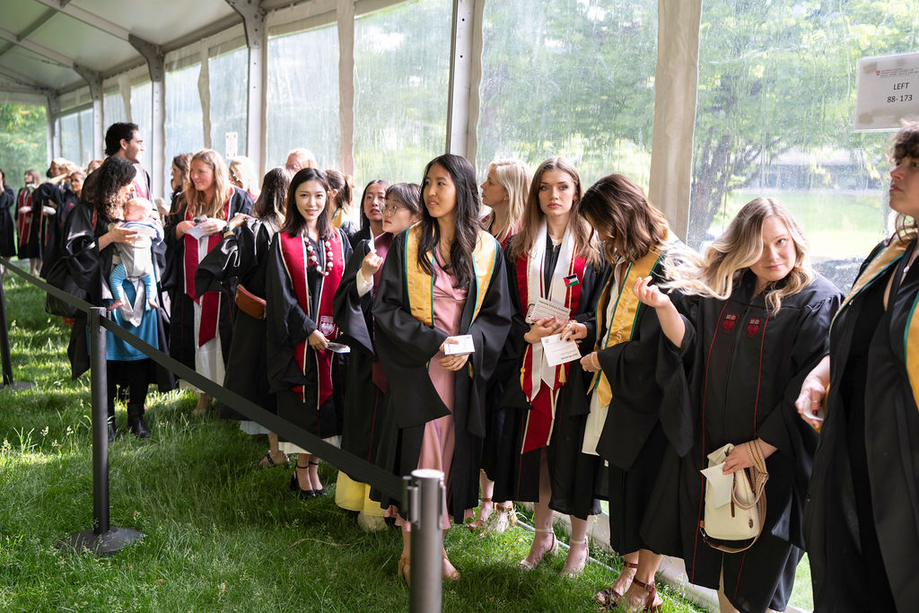 Group of graduates in line wearing regalia