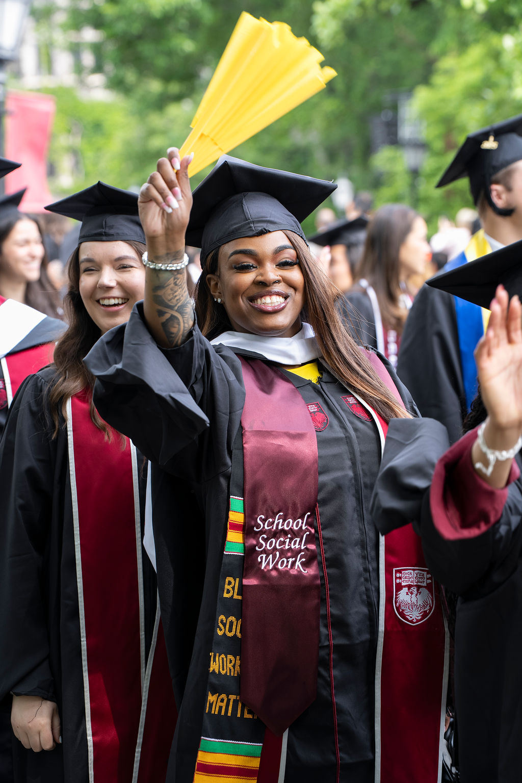 woman smiling and waving hand in the air