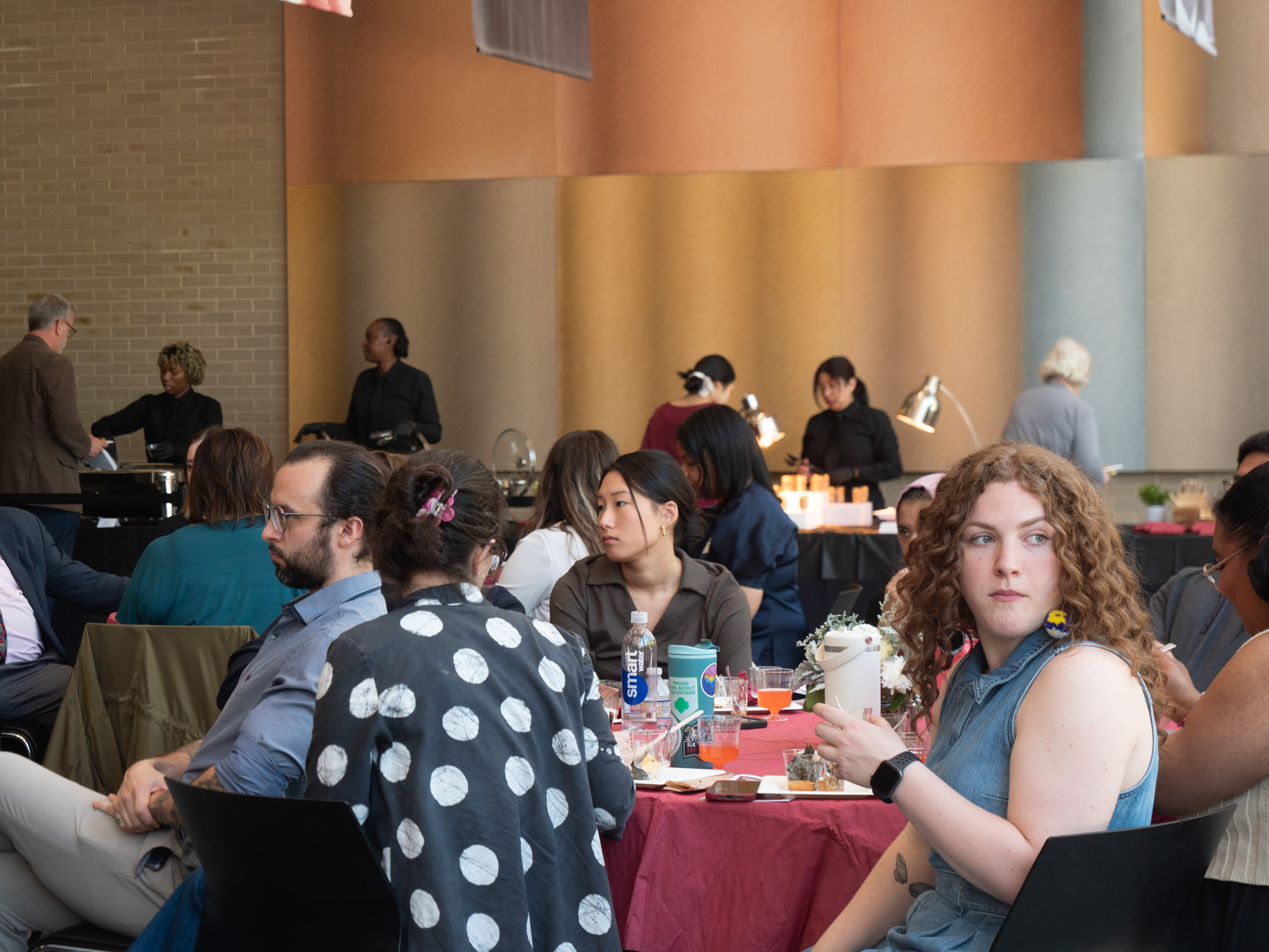 Image of a group of people sitting at a round banquet table