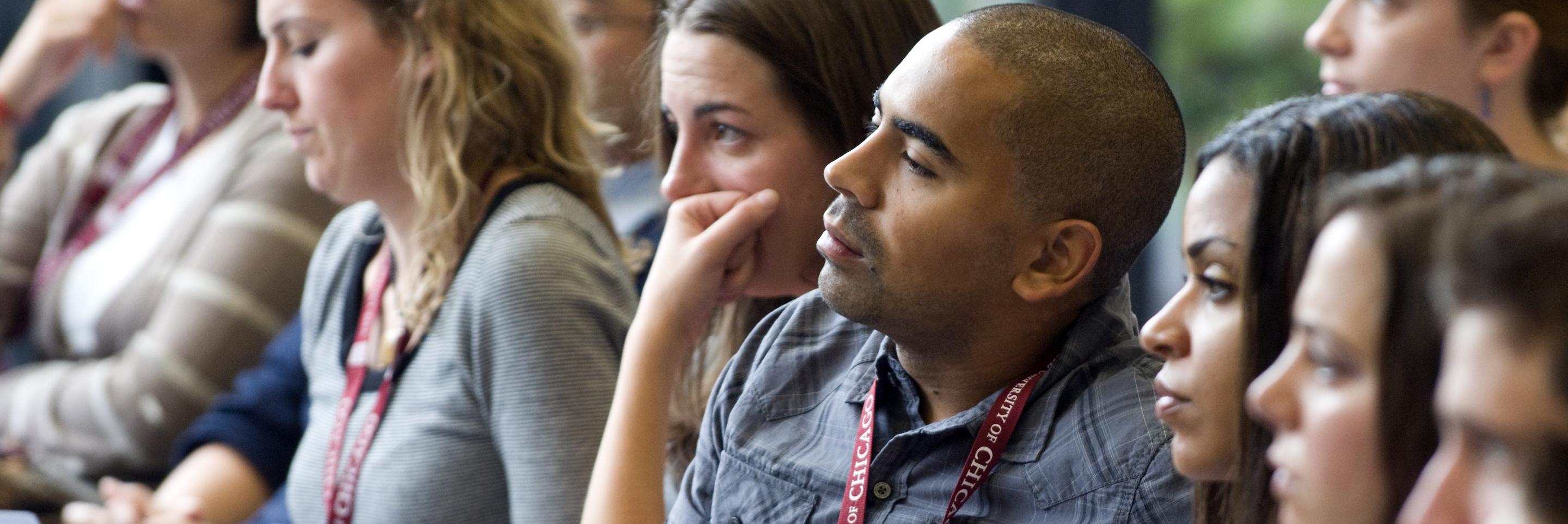 Group of students listening during an orientation presentation