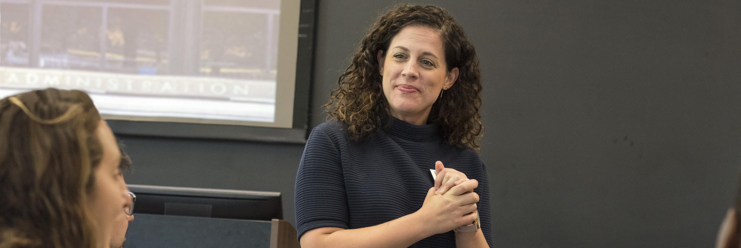 Woman speaks to classroom