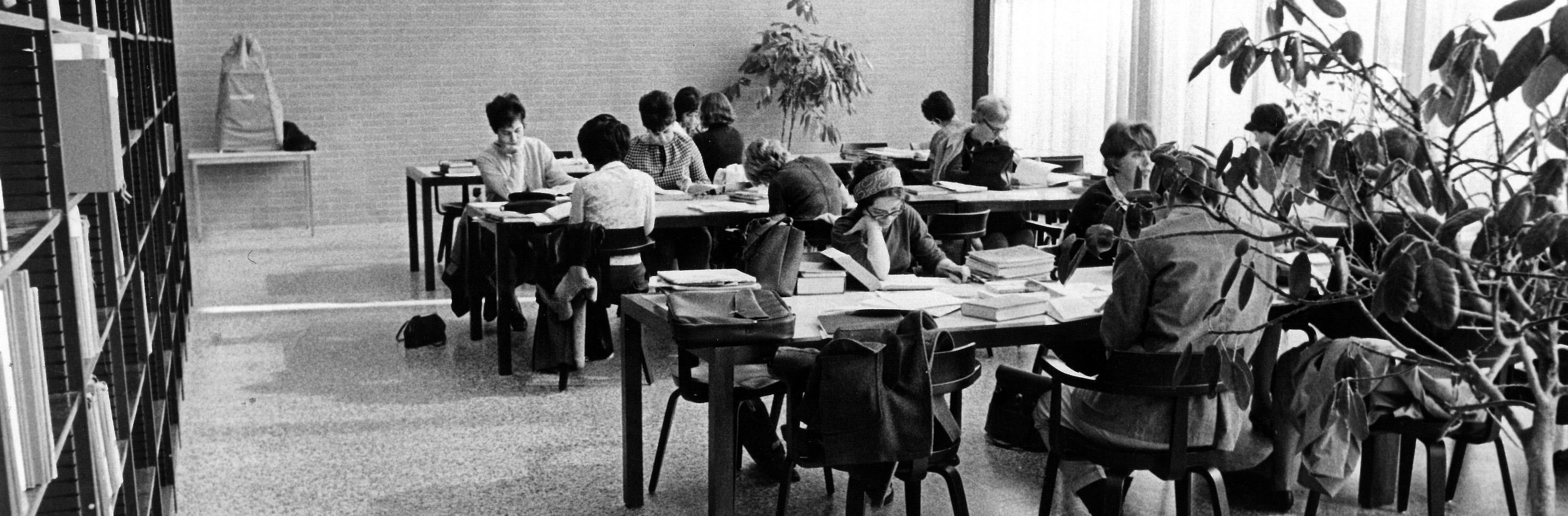 Black and white photo from 1967 of students working in the library