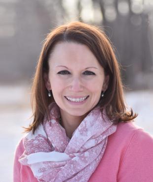 Thalia Anderen in a pink top and scarf pictured outside in a snowy setting