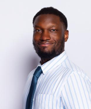 Black man smiling for headshot