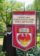 Jamahl Banks with the Crown Family School flag