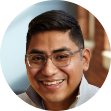 man with glasses smiling