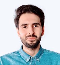 Man in a button up blue jean shirt